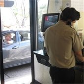 staff checking a guest in at the gate