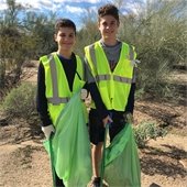 two boys participating in adopt-a-road cleanup