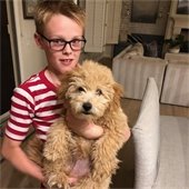 boy holding his dog