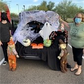 Grandmother with grandson by decorated car