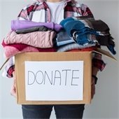 Box with clothes that says "Donate"