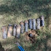 Damaged or Faulty sprinkler heads laying in grass