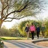 ladies walking on sidewalk