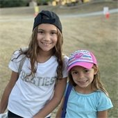 two girls at movie in the park event