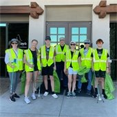 adopt a road volunteers in vest in front of GCA Office