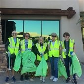 volunteers in vests in front of a building