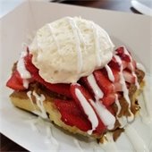 strawberry and ice cream on a waffle