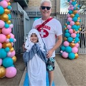 dad dressed as lifeguard and daughter dressed as shark
