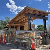 Talon Guardhouse with the banner hanging on the fence in front of it