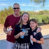 man and two girls eating ice cream
