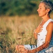 woman sitting in a field 