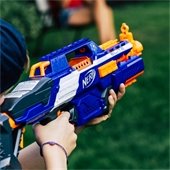 hand holding a blue nerf gun