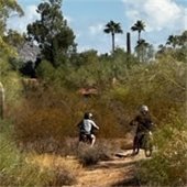 two boys on motor bikes