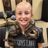 girl with snake around her neck