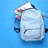 blue backpack with supplies falling out