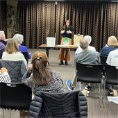 woman talking to group of people