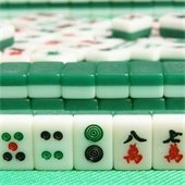 mah-jongg tiles on a green table