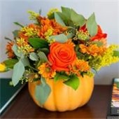 flowers in a pumpkin