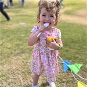 girl with pigtails eating ice cream