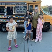 family standing by bus