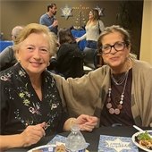 two women sitting at a table